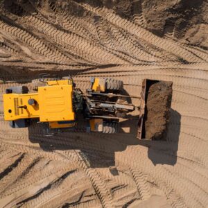 Aerial,Top,View,Yellow,Industrial,Excavator,Working,On,Sand,Quarry.