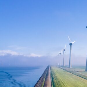offshore_windmill_park_with_clouds_and_a_blue_sky_windmill_park_in_the_ocean_aerial_view_with_1